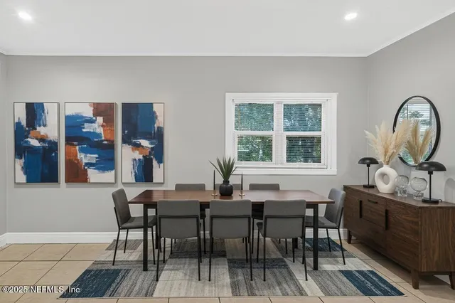 a view of a a dining room with furniture window and outside view
