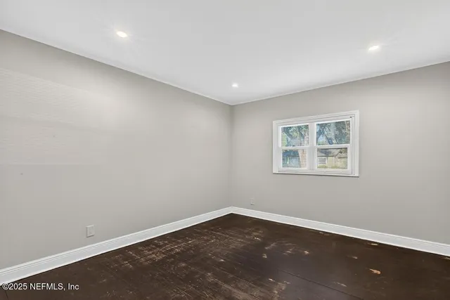 a bathroom with a toilet a sink and a mirror