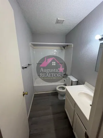 a bathroom with a sink and toilet
