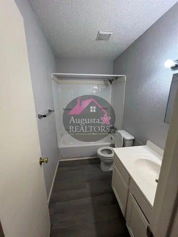 a bathroom with a sink and toilet