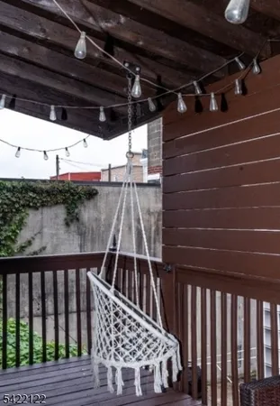 a view of a terrace with furniture