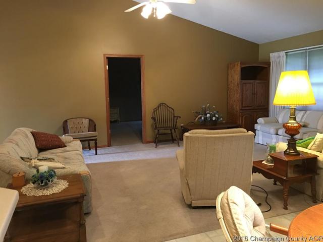 804 Kara Street St. Joseph, IL 61873 - Photo 11 of 24 a living room with furniture and a lamp