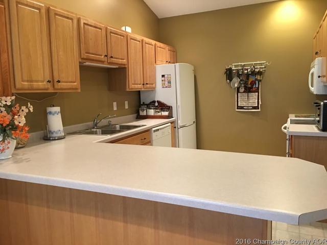 804 Kara Street St. Joseph, IL 61873 - Photo 3 of 24 a kitchen with stainless steel appliances a refrigerator a sink a stove and white cabinets