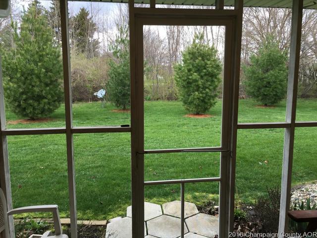 804 Kara Street St. Joseph, IL 61873 - Photo 22 of 24 a view of backyard with large trees and plants