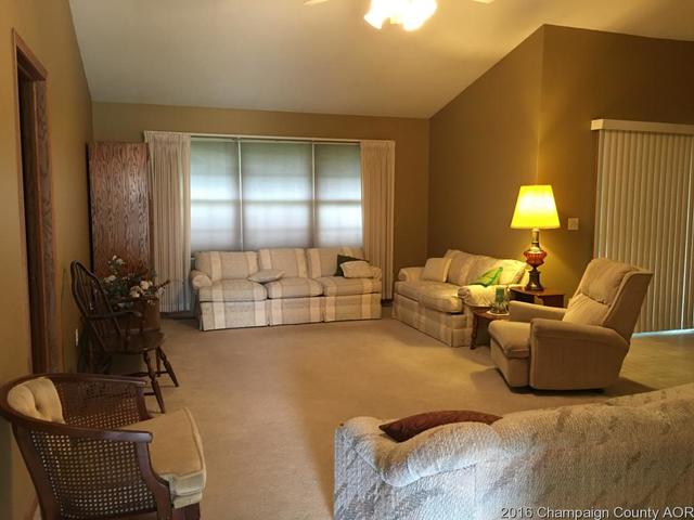 804 Kara Street St. Joseph, IL 61873 - Photo 9 of 24 a living room with furniture and a lamp