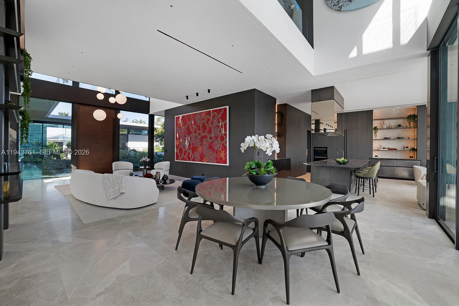 217 East Rivo Alto Drive Miami Beach, FL 33139 - Photo 14 of 87 a view of a dining room with furniture and chandelier