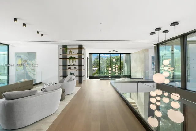 a bedroom with a bed and a potted plant on the dresser