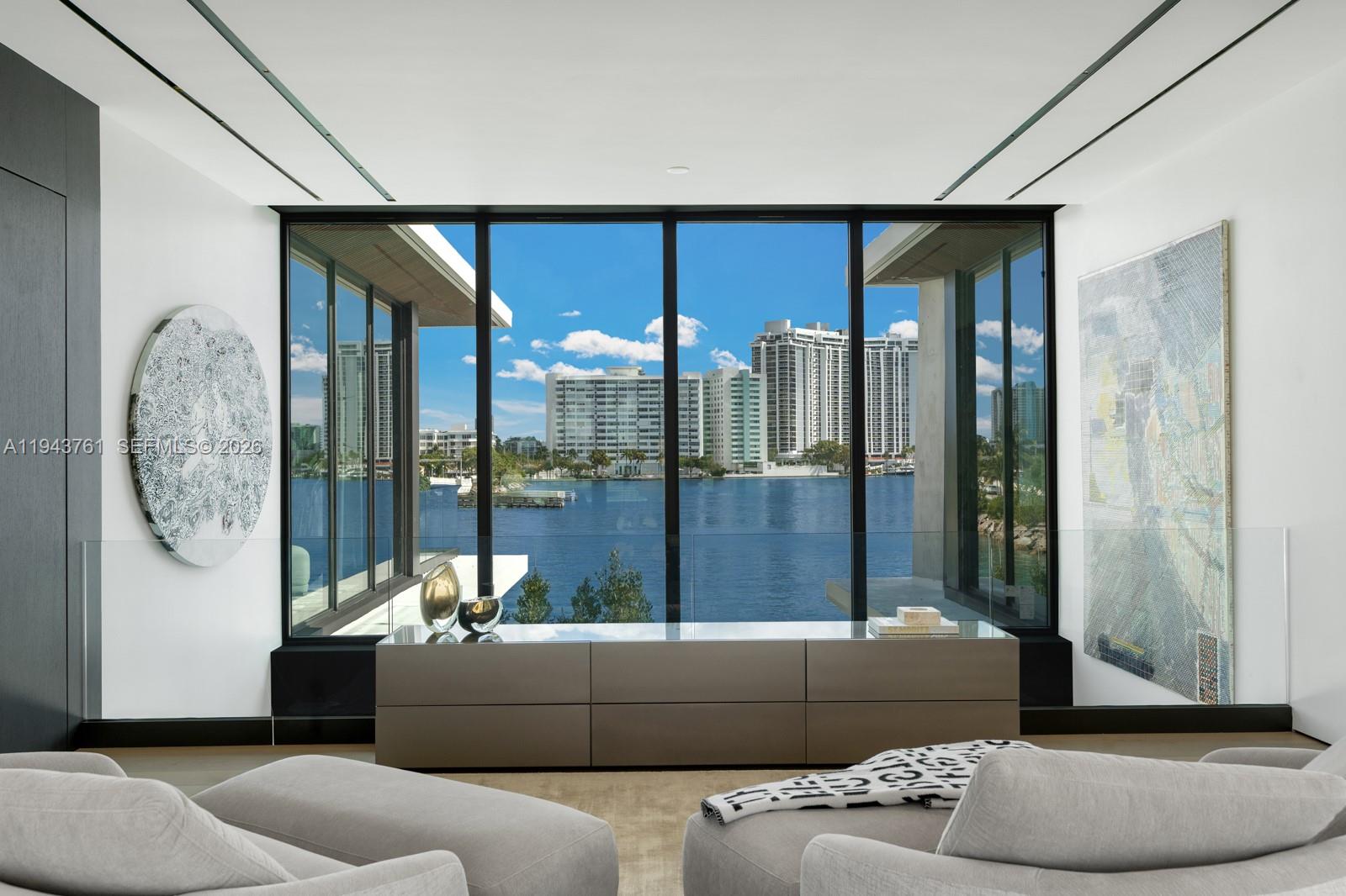 217 East Rivo Alto Drive Miami Beach, FL 33139 - Photo 21 of 87 a living room with furniture and a floor to ceiling window