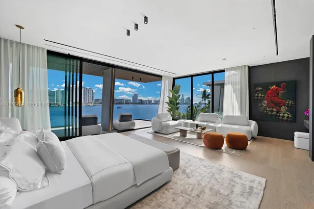 a backyard of a house with plants and outdoor seating