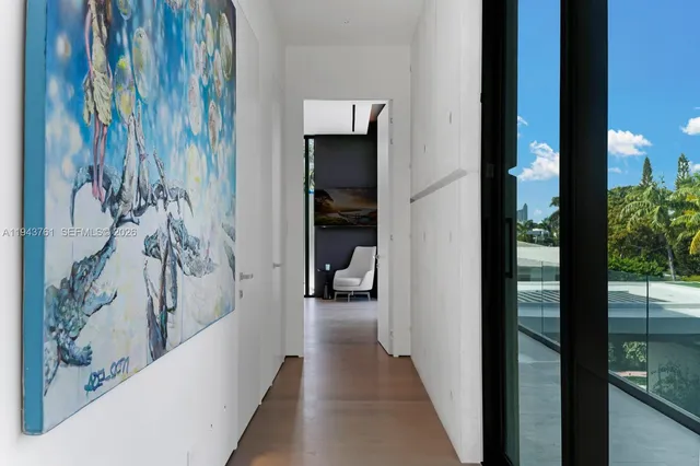 a view of a house with floor to ceiling windows and a table