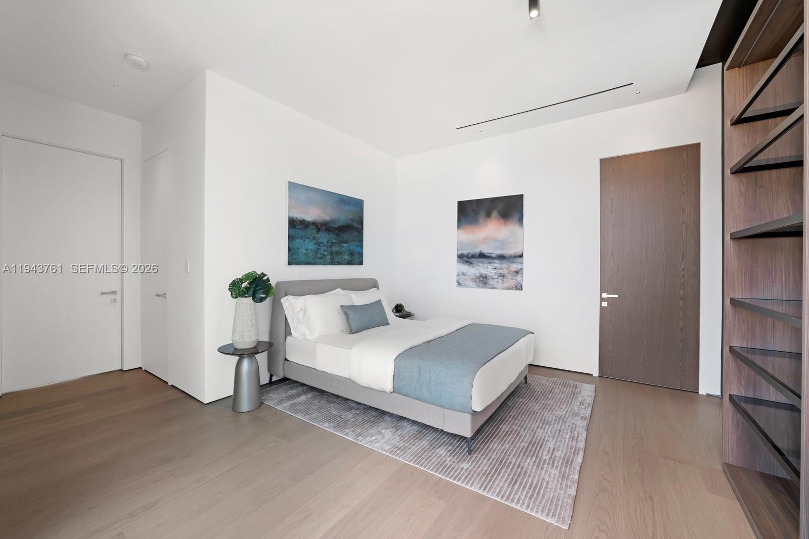 217 East Rivo Alto Drive Miami Beach, FL 33139 - Photo 34 of 87 a bedroom with a bed and a potted plant on the dresser