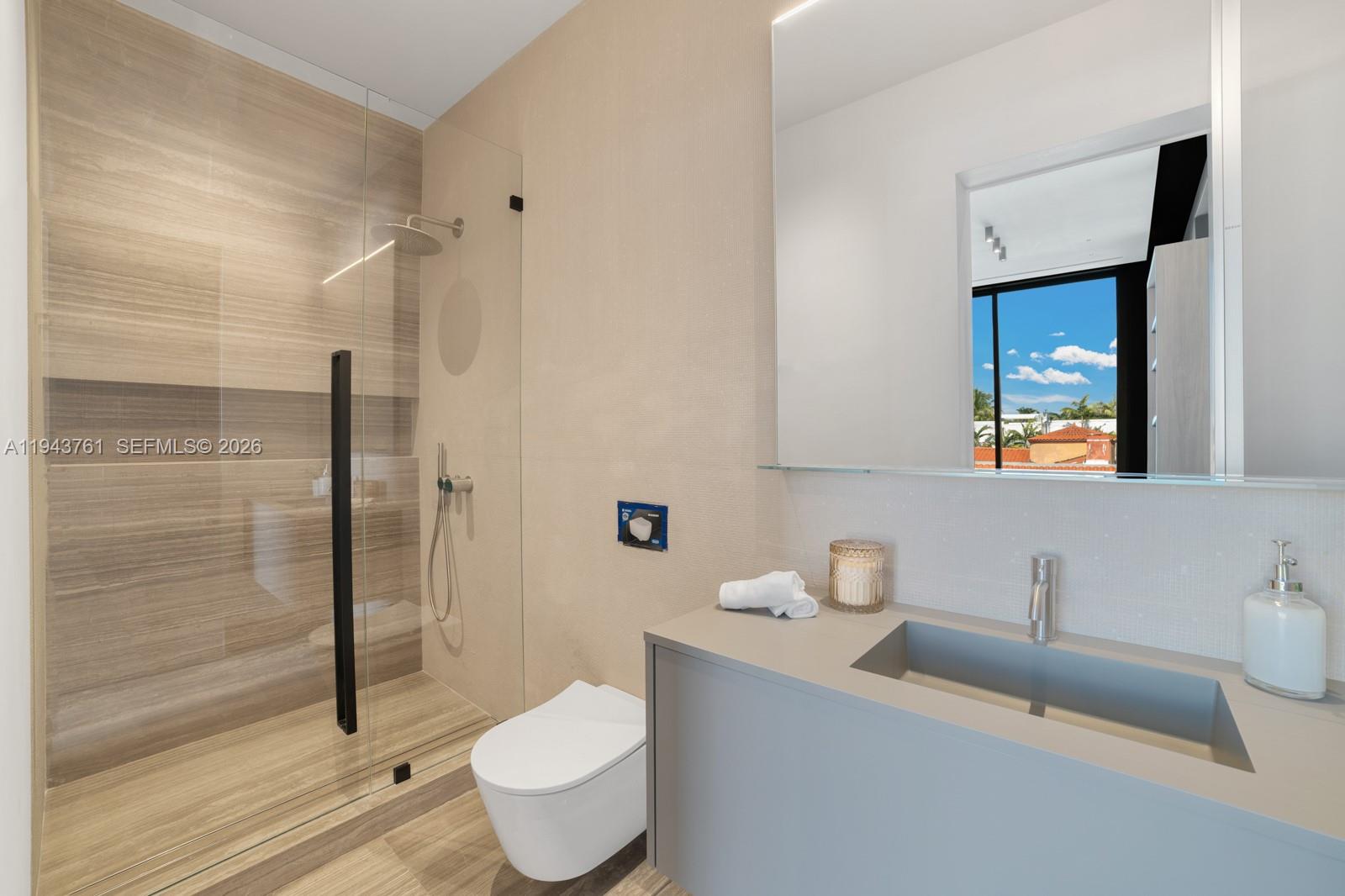 217 East Rivo Alto Drive Miami Beach, FL 33139 - Photo 35 of 87 a bathroom with a toilet a sink and shower