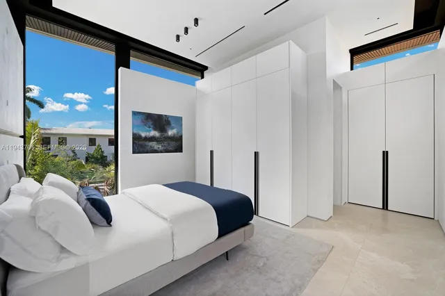 a living room with patio furniture and a flat screen tv