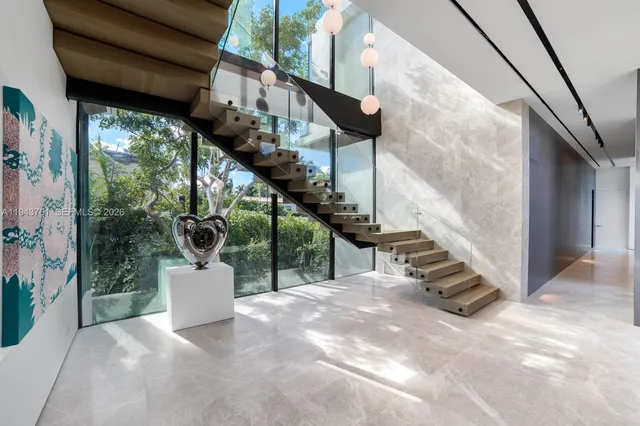 a living room with furniture and outdoor view