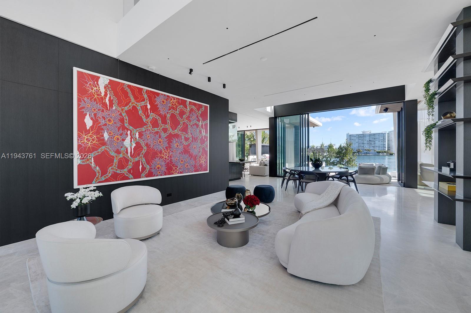 217 East Rivo Alto Drive Miami Beach, FL 33139 - Photo 46 of 87 a living room with furniture a rug and a large window