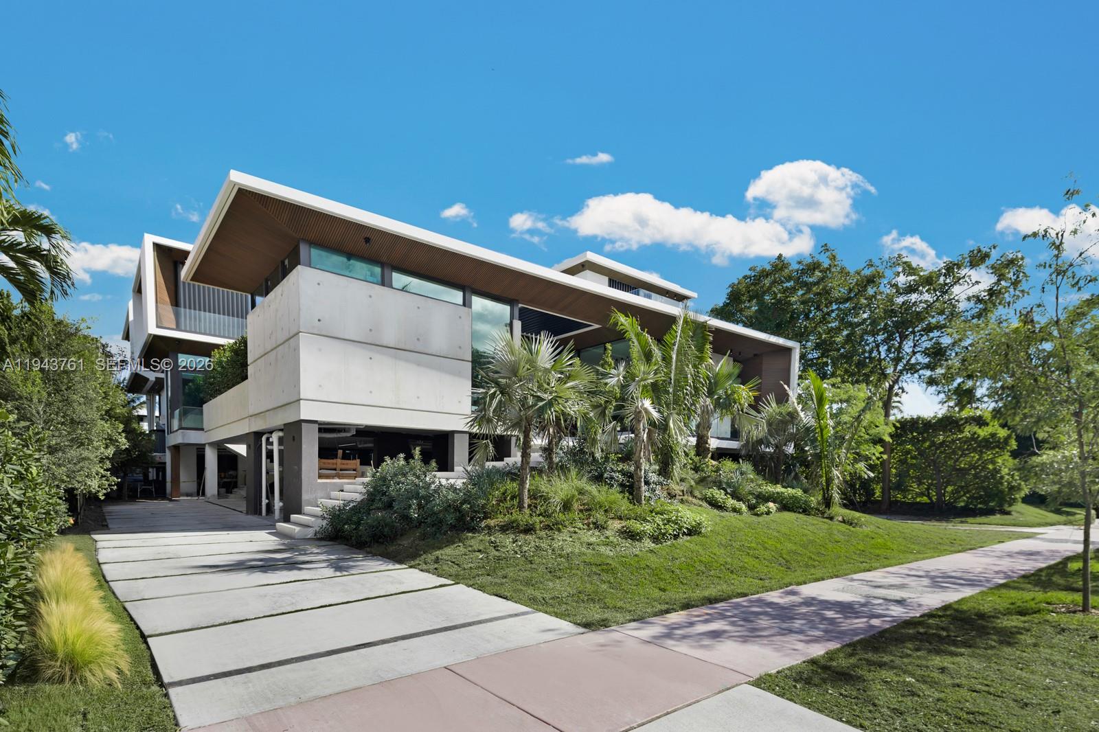 217 East Rivo Alto Drive Miami Beach, FL 33139 - Photo 55 of 87 a front view of a house with a yard