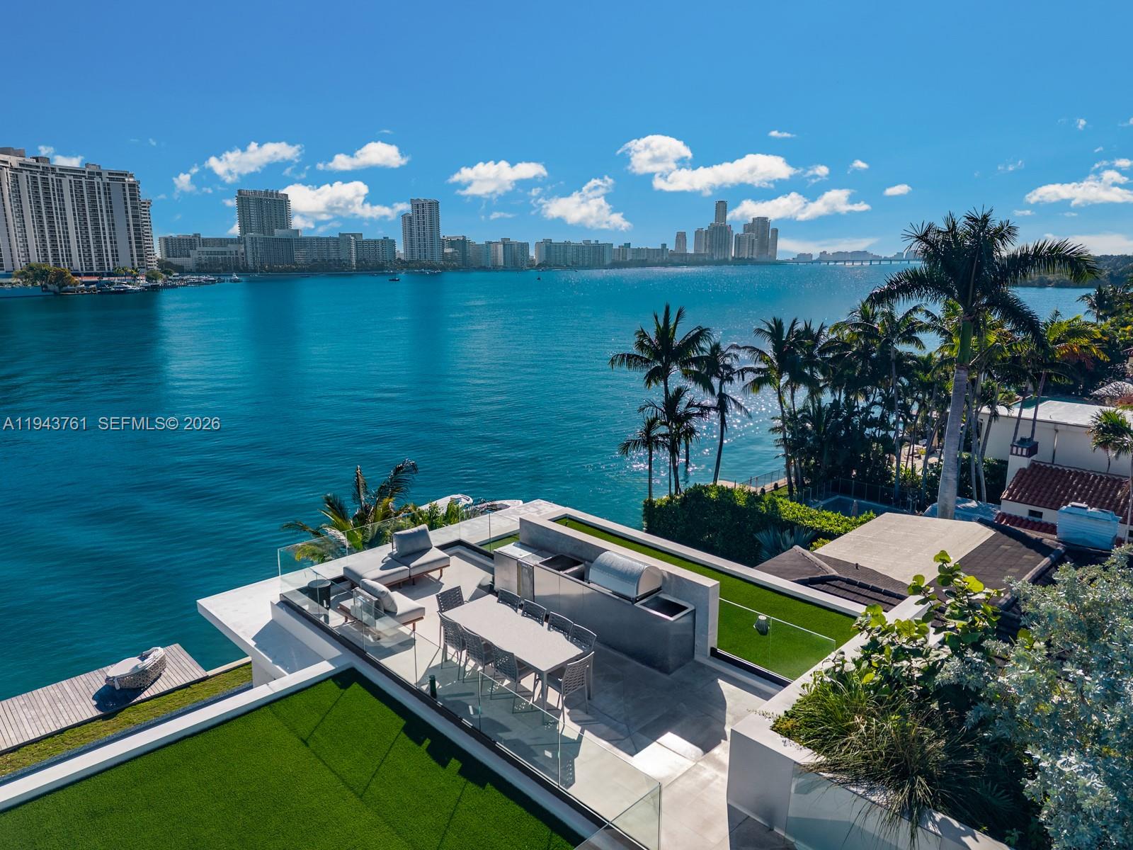 217 East Rivo Alto Drive Miami Beach, FL 33139 - Photo 62 of 87 a view of a lake and a yard