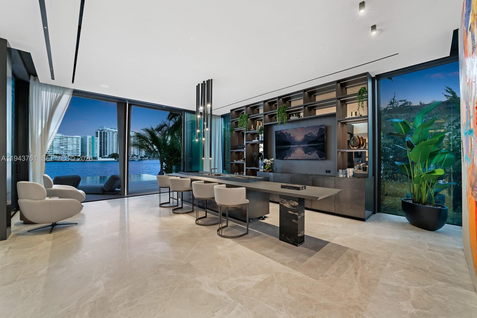 217 East Rivo Alto Drive Miami Beach, FL 33139 - Photo 66 of 87 a living room with patio furniture and a flat screen tv