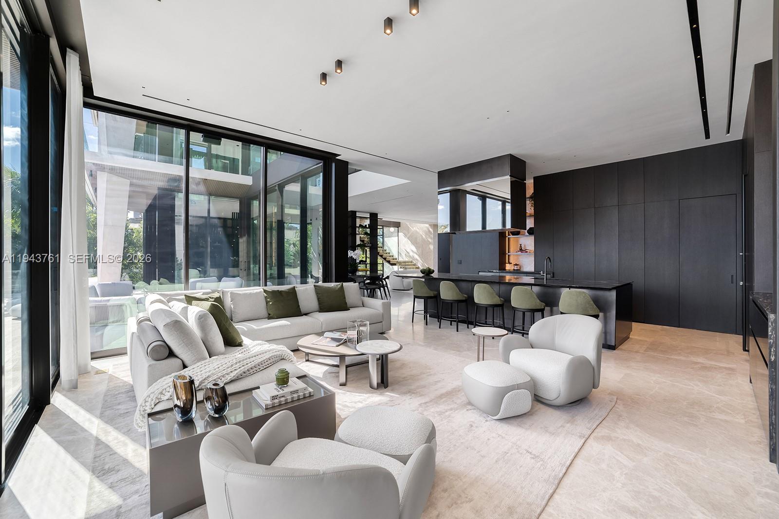 217 East Rivo Alto Drive Miami Beach, FL 33139 - Photo 7 of 87 a living room with furniture and a large window