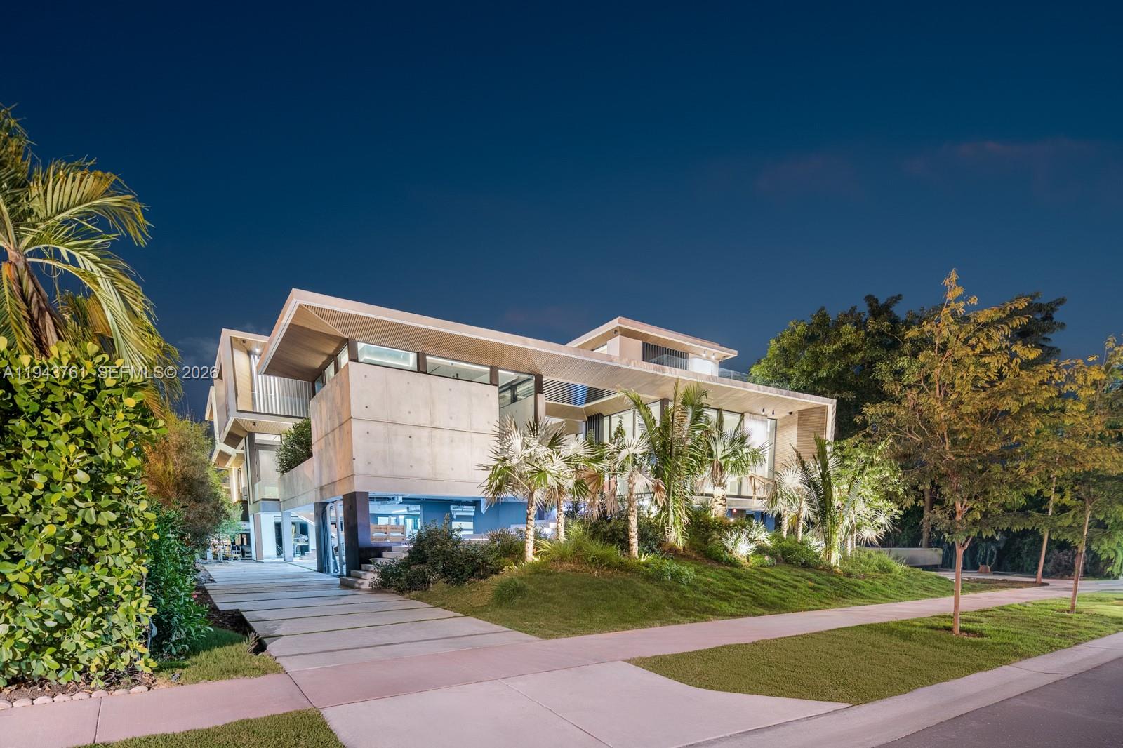 217 East Rivo Alto Drive Miami Beach, FL 33139 - Photo 80 of 87 a front view of a house with a garden