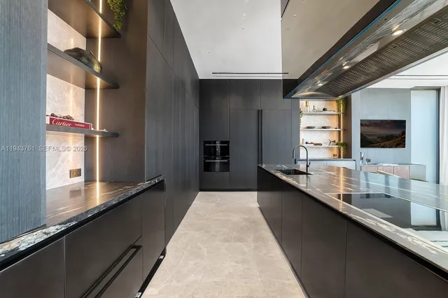 a living room with patio furniture and a large window