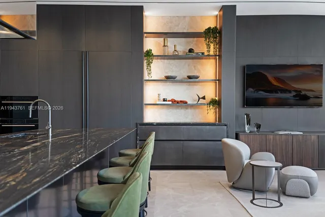 a living room with fireplace furniture and a large window