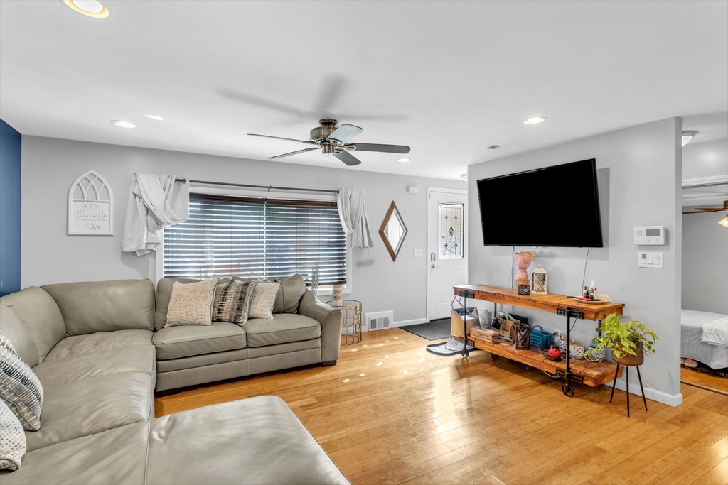 30 Fayette Street Springfield, MA 01118 - Photo 6 of 28 a living room with furniture and a flat screen tv