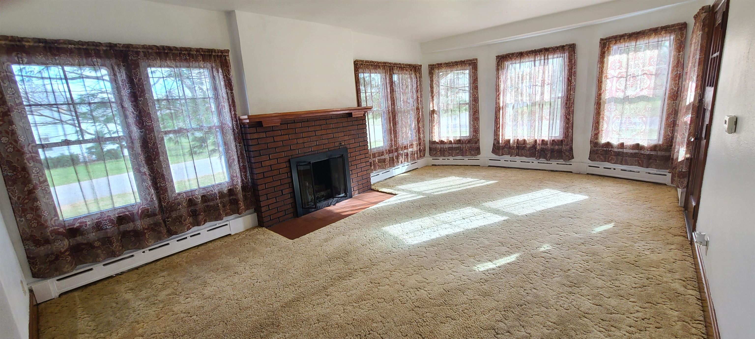 302 Sunset Lane Mount Morris, IL 61054 - Photo 3 of 47 a view of an empty room with windows