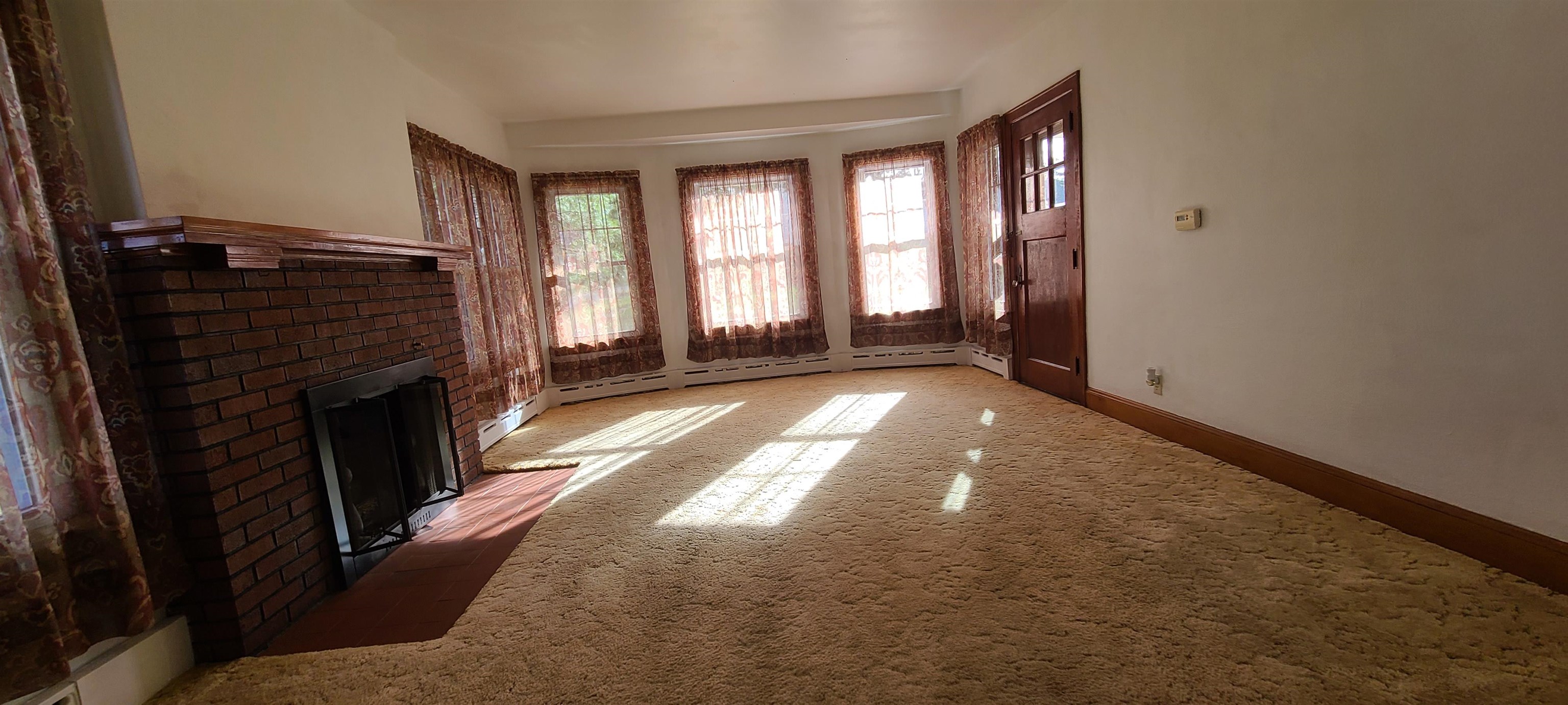 302 Sunset Lane Mount Morris, IL 61054 - Photo 5 of 47 a view of a windows and an empty room with a fireplace