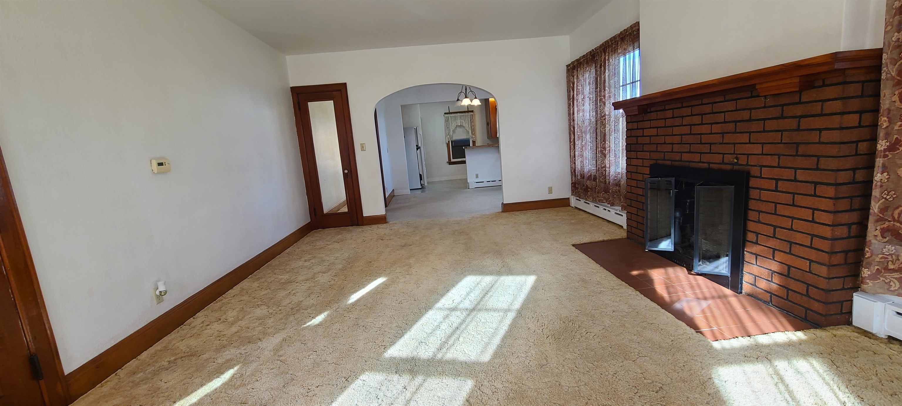 302 Sunset Lane Mount Morris, IL 61054 - Photo 6 of 47 a view of a livingroom with wooden floor and a fireplace