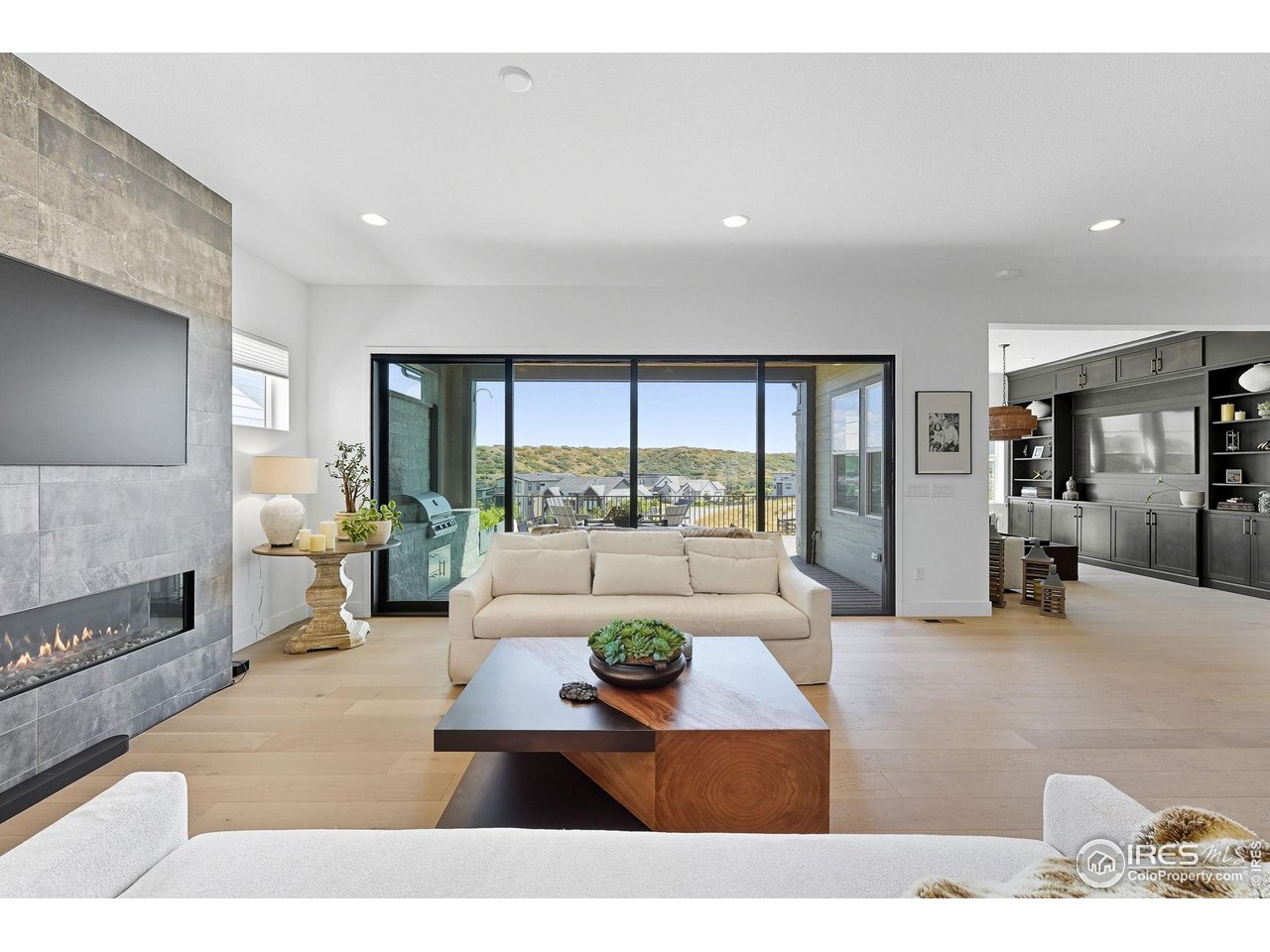 7382 Canyonpoint Road Castle Pines, CO 80108 - Photo 15 of 49 a living room with furniture and a large window
