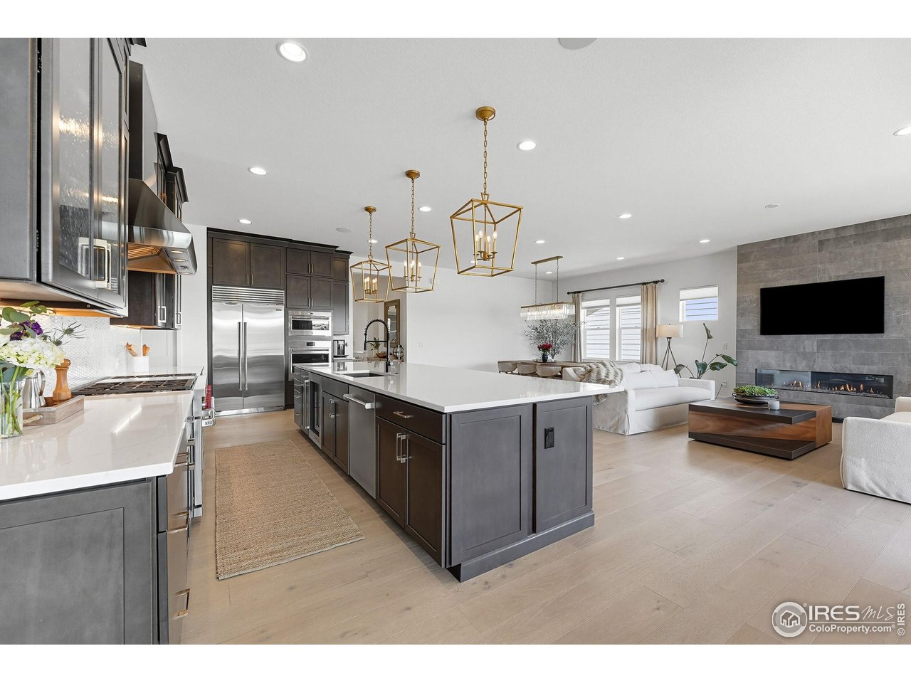 7382 Canyonpoint Road Castle Pines, CO 80108 - Photo 19 of 49 a kitchen with counter top space and stainless steel appliances