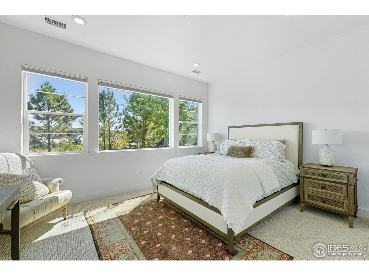 7382 Canyonpoint Road Castle Pines, CO 80108 - Photo 31 of 49 a bedroom with a bed and a window