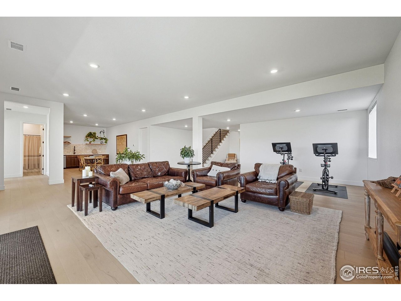 7382 Canyonpoint Road Castle Pines, CO 80108 - Photo 33 of 49 a living room with lots of furniture and a large window