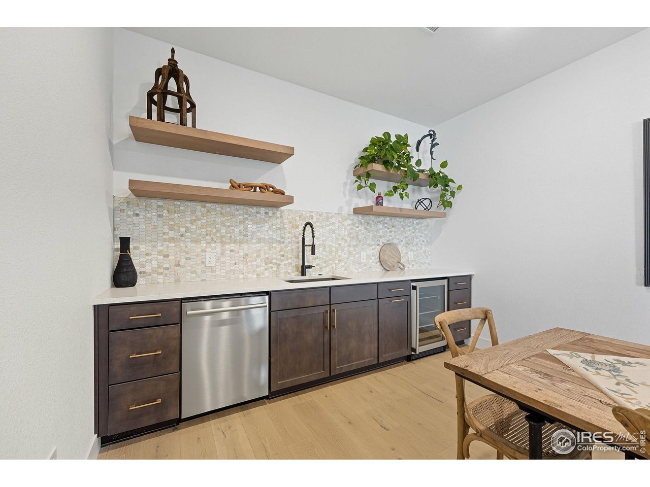 7382 Canyonpoint Road Castle Pines, CO 80108 - Photo 34 of 49 a kitchen with stainless steel appliances granite countertop a sink and cabinets