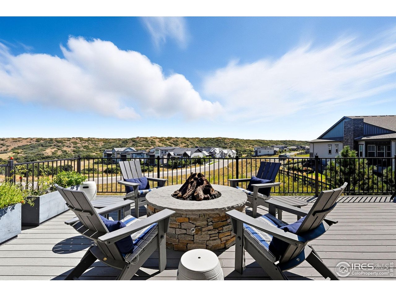 7382 Canyonpoint Road Castle Pines, CO 80108 - Photo 40 of 49 a view of a roof deck with sitting area