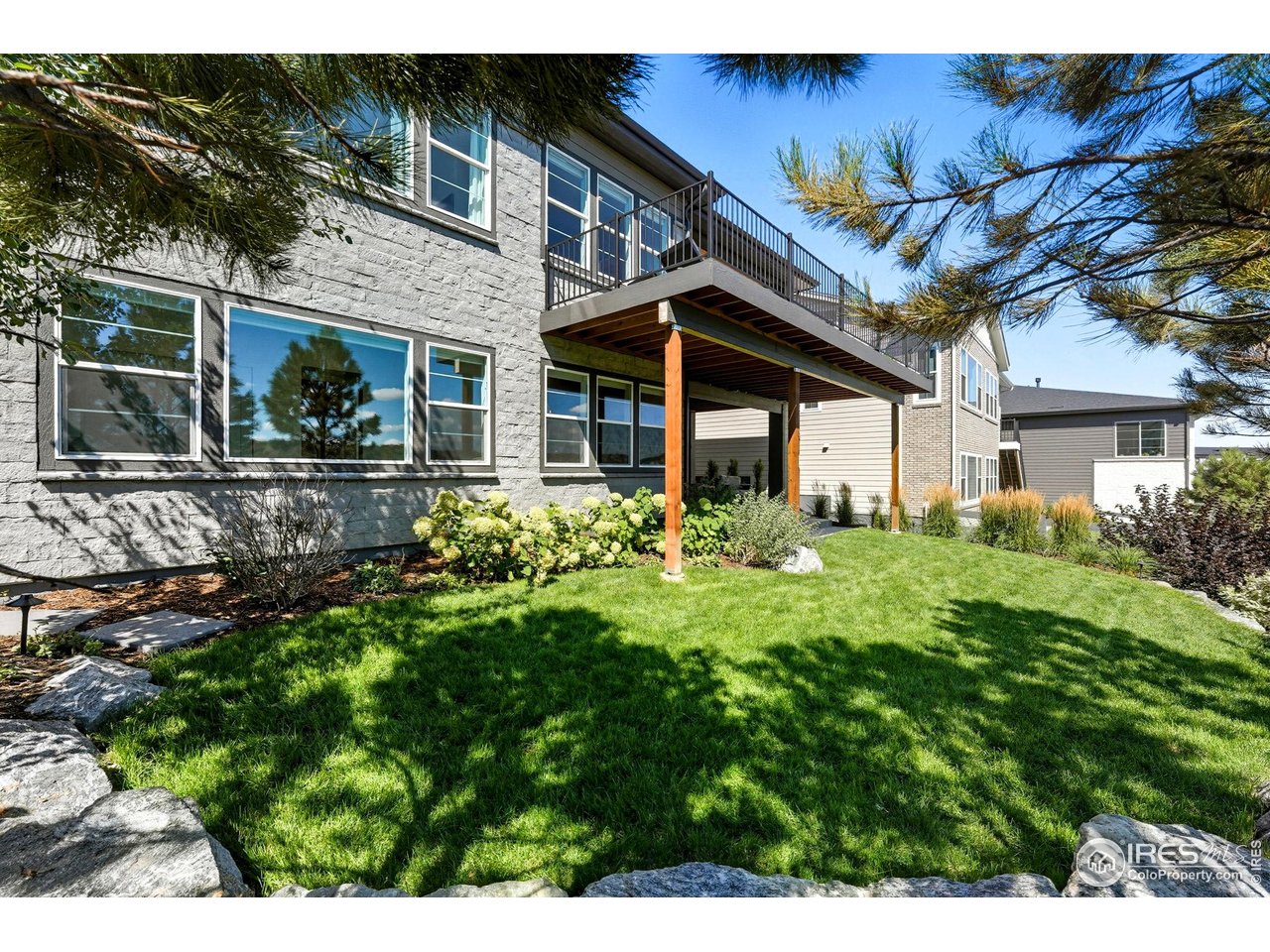7382 Canyonpoint Road Castle Pines, CO 80108 - Photo 43 of 49 a front view of a house with a yard