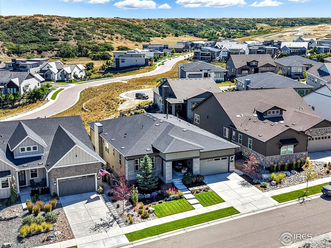 7382 Canyonpoint Road Castle Pines, CO 80108 - Photo 46 of 49 an aerial view of a house with a garden