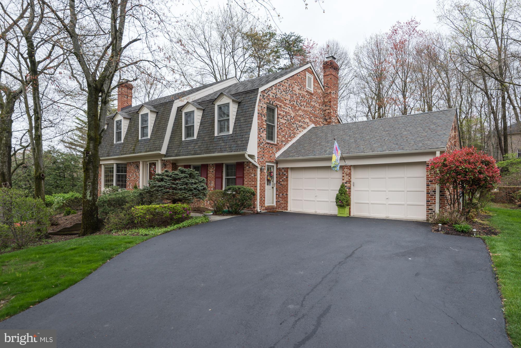a view of a house with a yard and garage