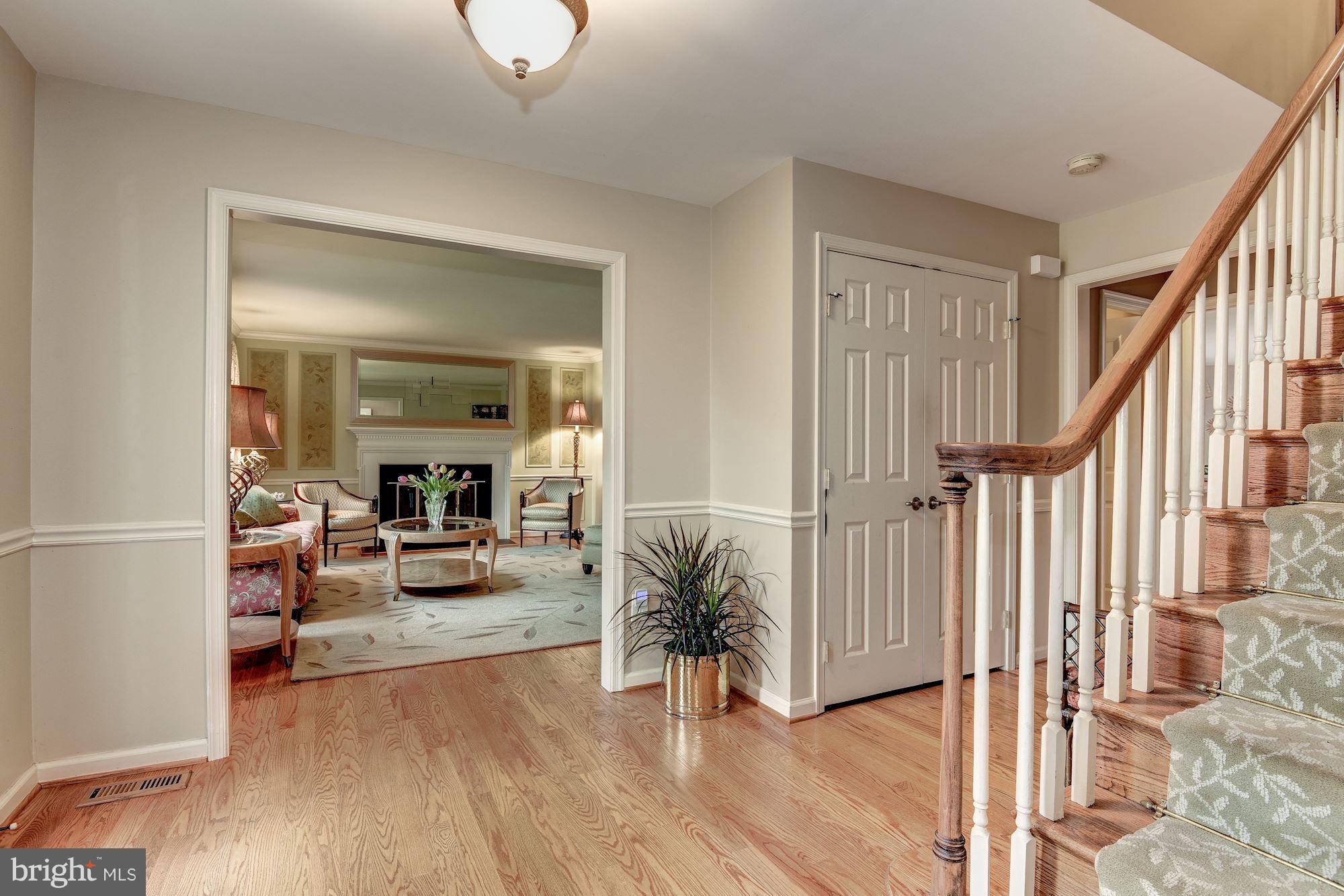 9204 Fall River Lane Potomac, MD 20854 - Photo 2 of 30 a view of a livingroom with furniture and hardwood floor