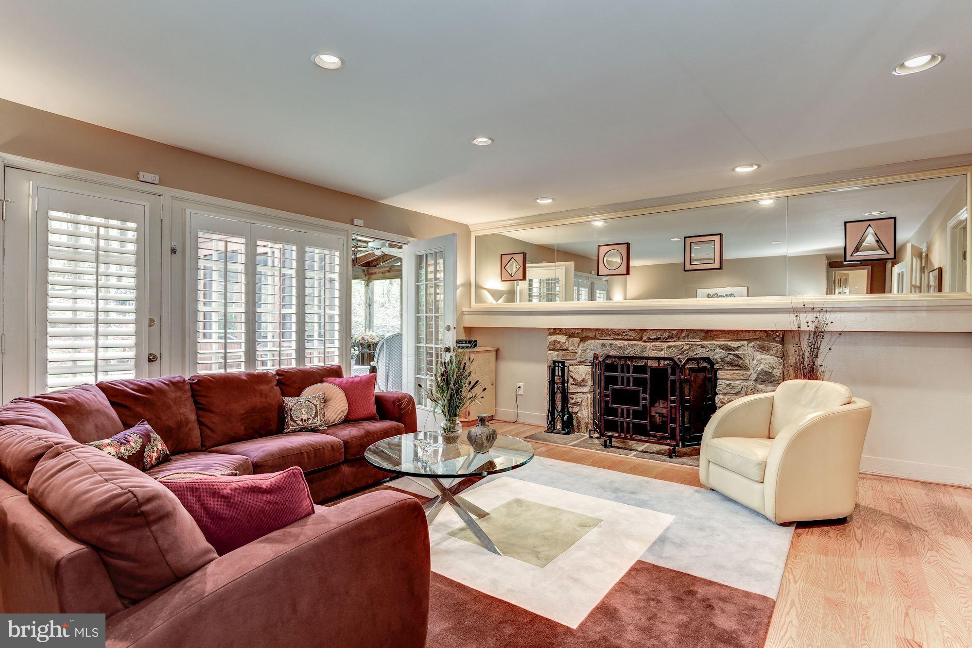 9204 Fall River Lane Potomac, MD 20854 - Photo 12 of 30 a living room with furniture and a fireplace