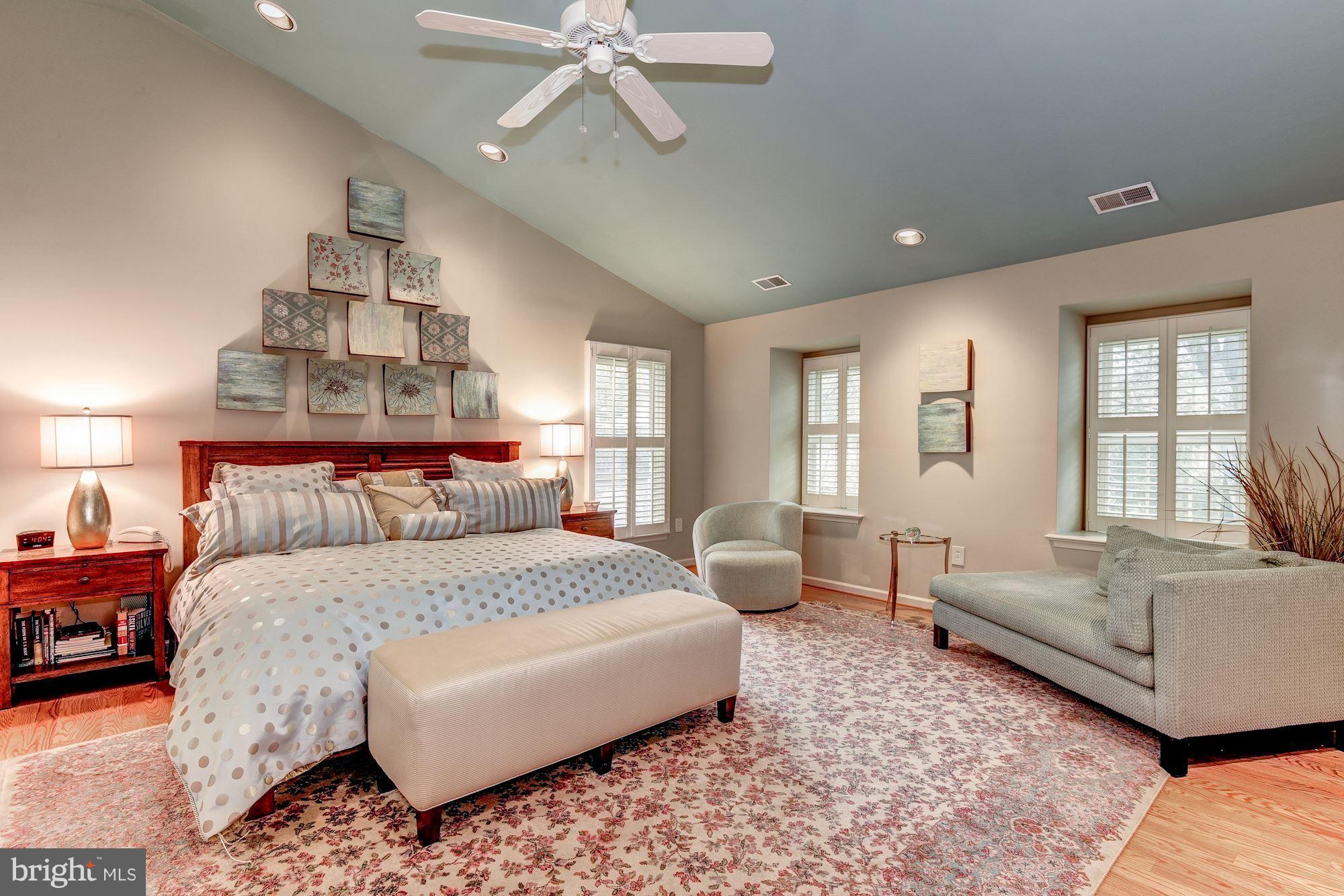 9204 Fall River Lane Potomac, MD 20854 - Photo 15 of 30 a bedroom with a large bed and a couch