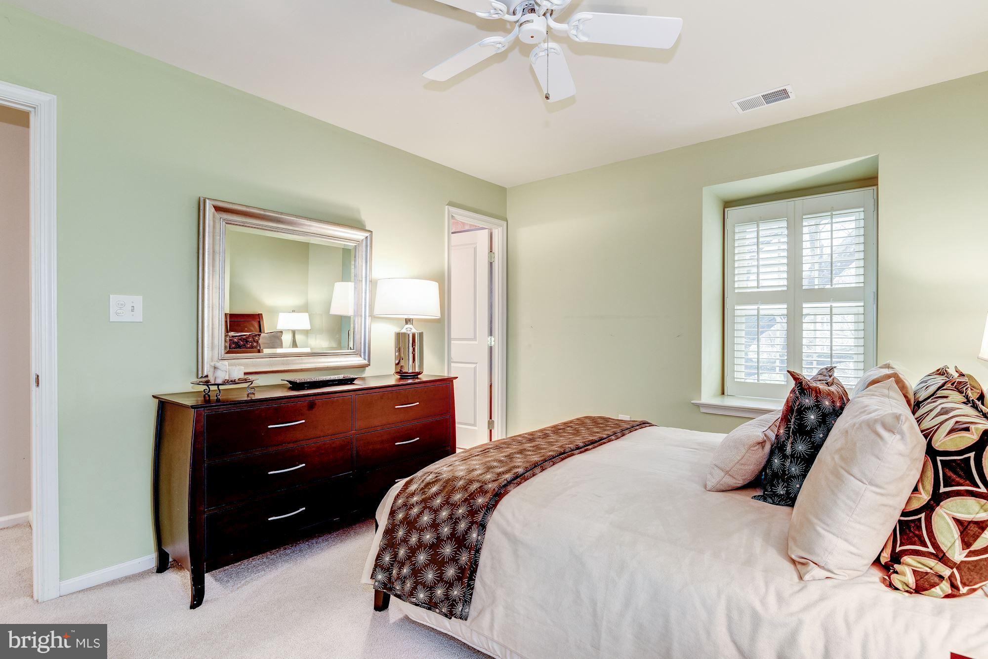 9204 Fall River Lane Potomac, MD 20854 - Photo 20 of 30 a bedroom with a bed and a dresser