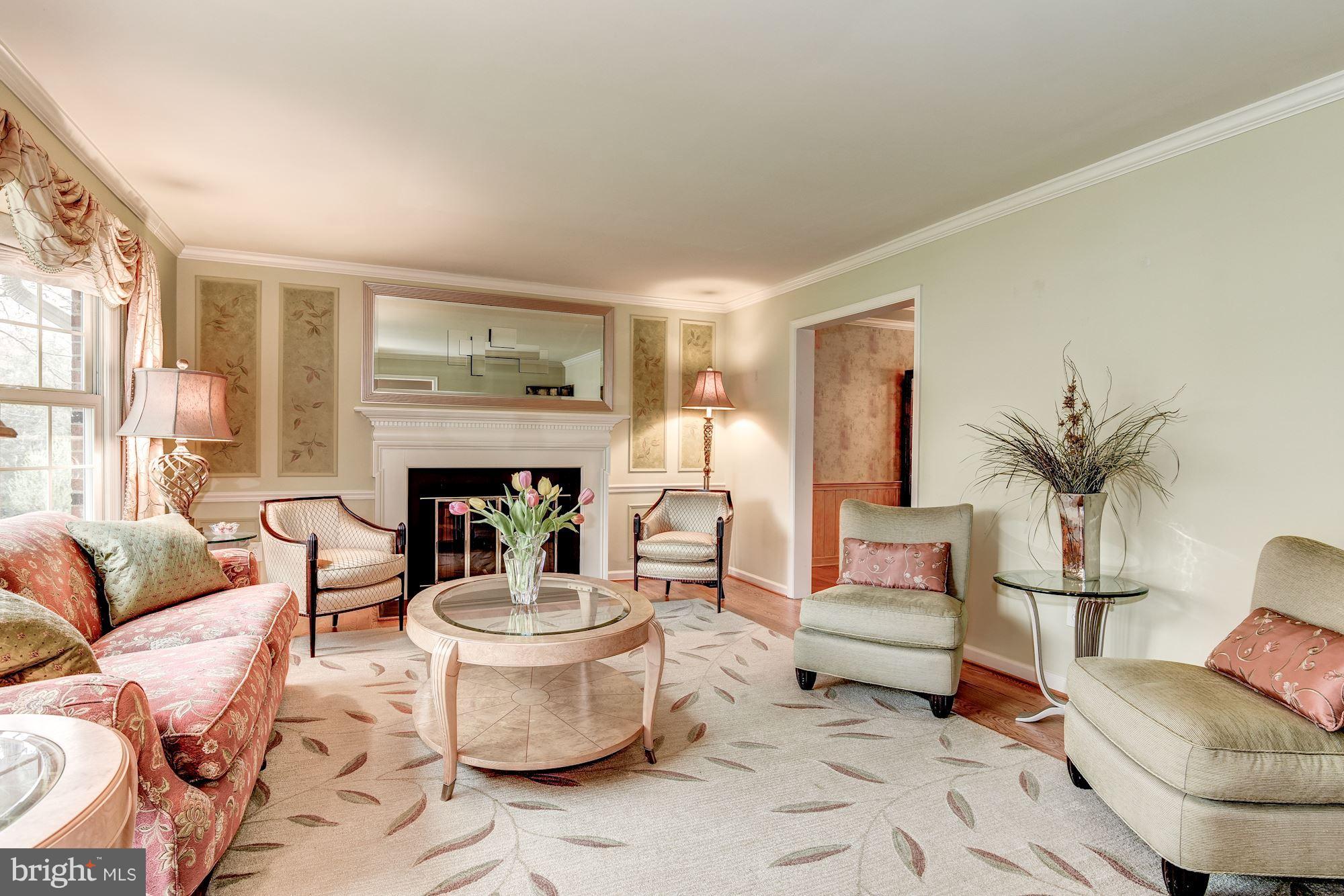 9204 Fall River Lane Potomac, MD 20854 - Photo 3 of 30 a living room with furniture and a fireplace