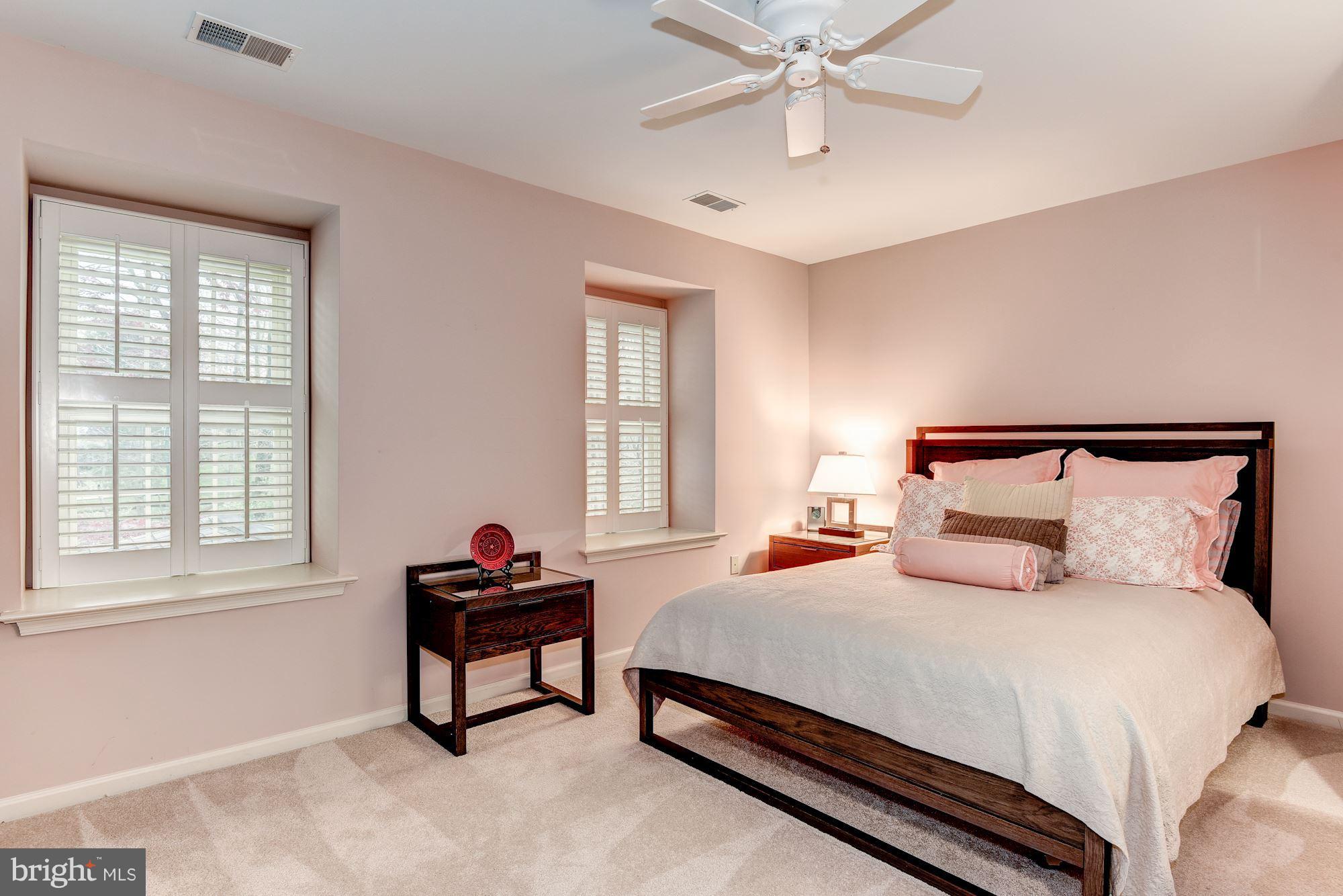 9204 Fall River Lane Potomac, MD 20854 - Photo 22 of 30 a bedroom with a bed and window