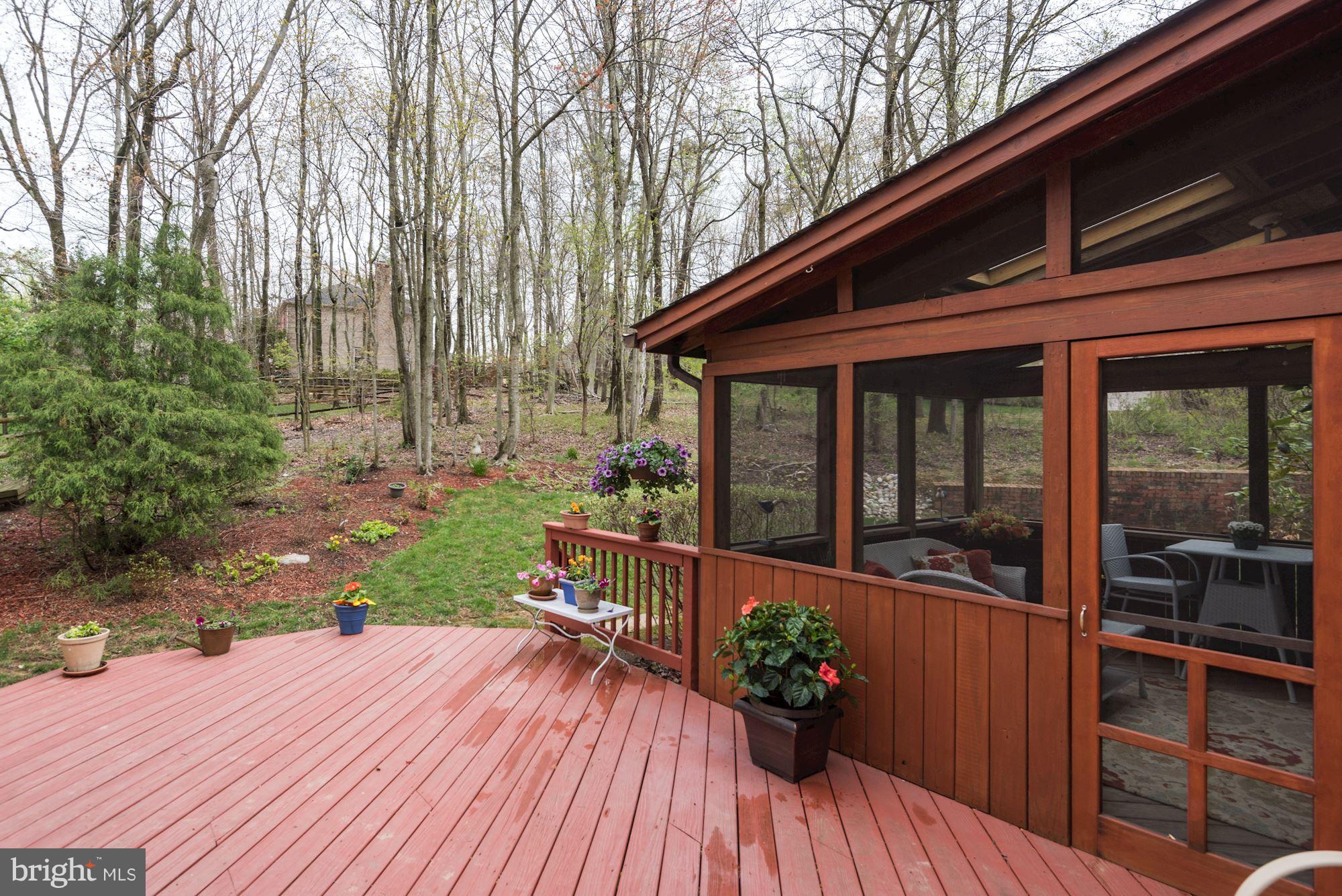 9204 Fall River Lane Potomac, MD 20854 - Photo 29 of 30 a view of a house with a porch and wooden flooring