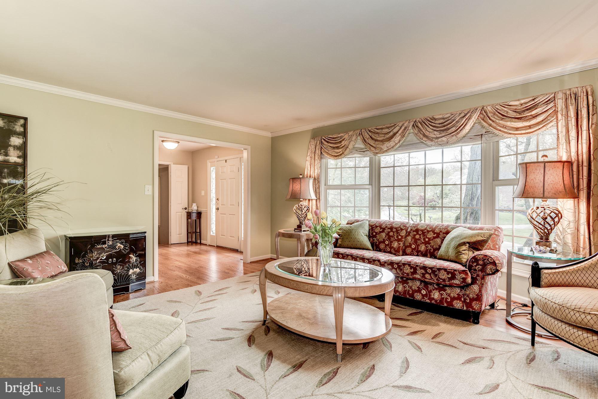 9204 Fall River Lane Potomac, MD 20854 - Photo 4 of 30 a living room with furniture and a large window