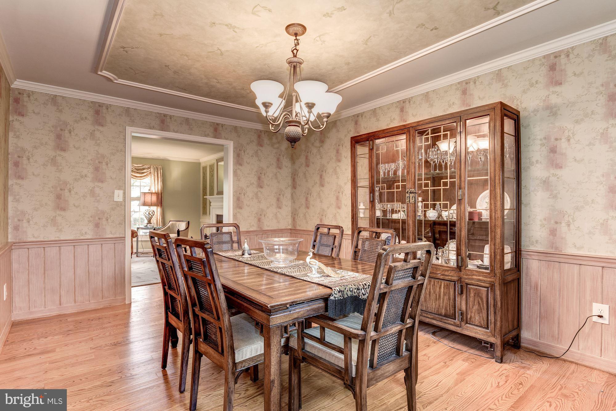 9204 Fall River Lane Potomac, MD 20854 - Photo 5 of 30 a view of a dining room with furniture window and wooden floor