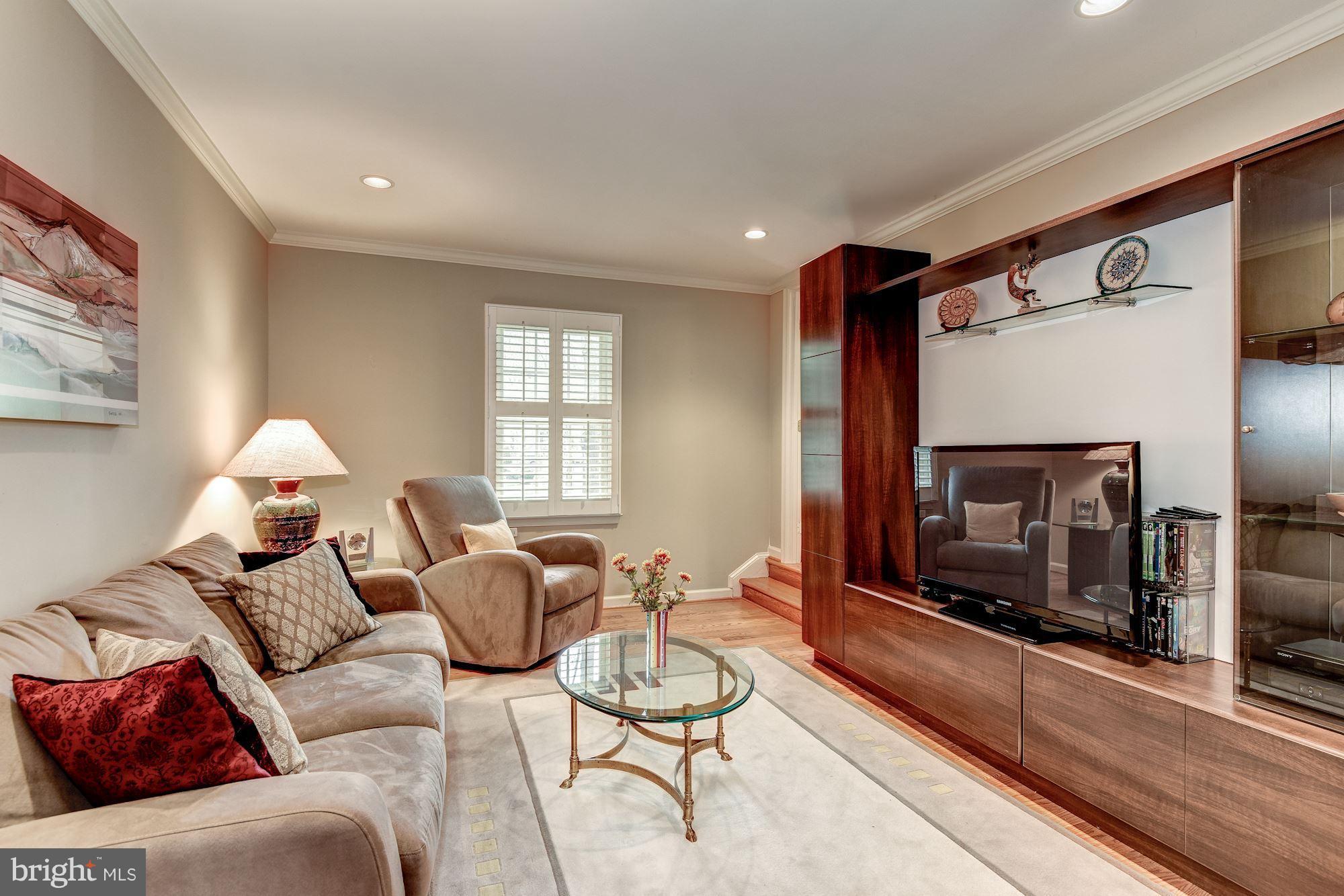9204 Fall River Lane Potomac, MD 20854 - Photo 6 of 30 a living room with furniture a window and a fireplace