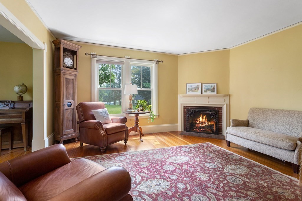 44 Old Ayer Road Groton, MA 01450 - Photo 15 of 41 a living room with furniture and a fireplace